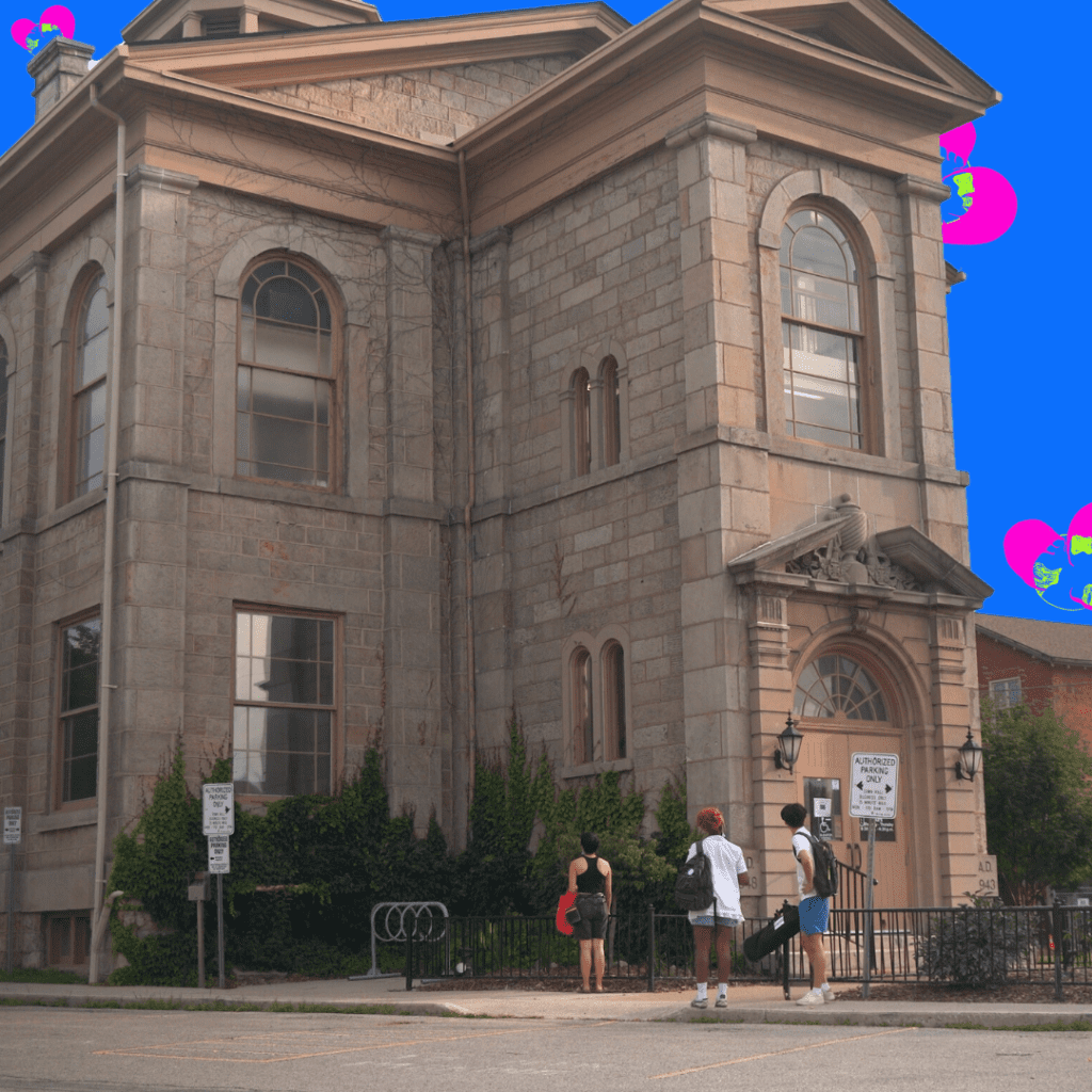 peace love (unicorns) & communism film grab - image of a lage brown building with 3 students of different genders and racial backgrounds standing in front looking up at the large building. the background is colored on in blue with swirls of bright pink and green symbols.